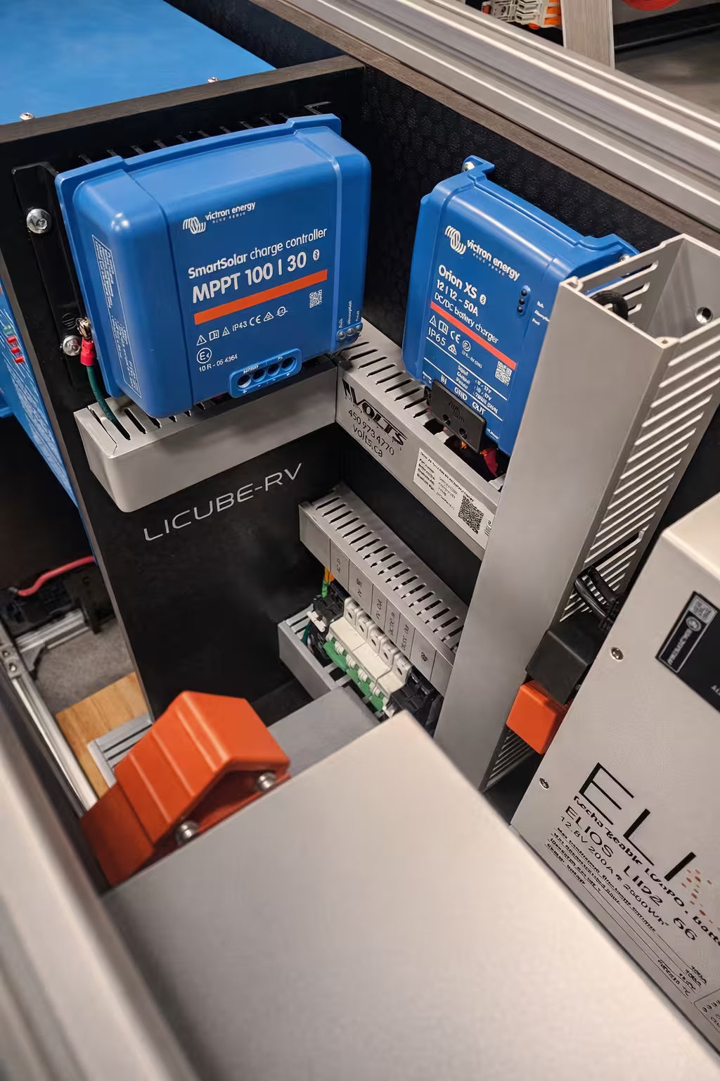 Li-Cube RV Portable Power System close-up of Victron MPPT solar charge controllers and inverter mounted inside the equipment rack